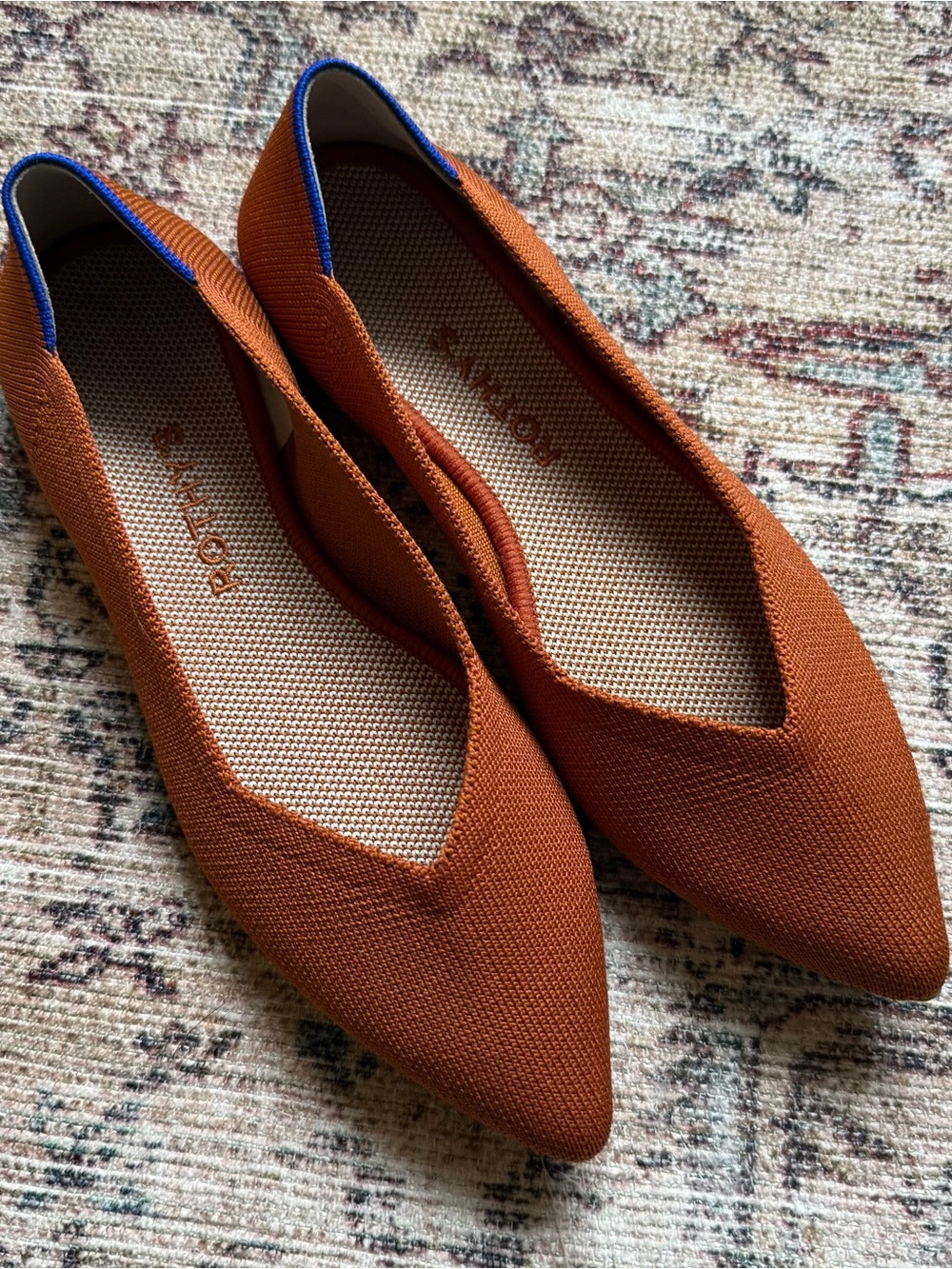 Rothy's Pointed Knit Flats in Rust with Blue Accent